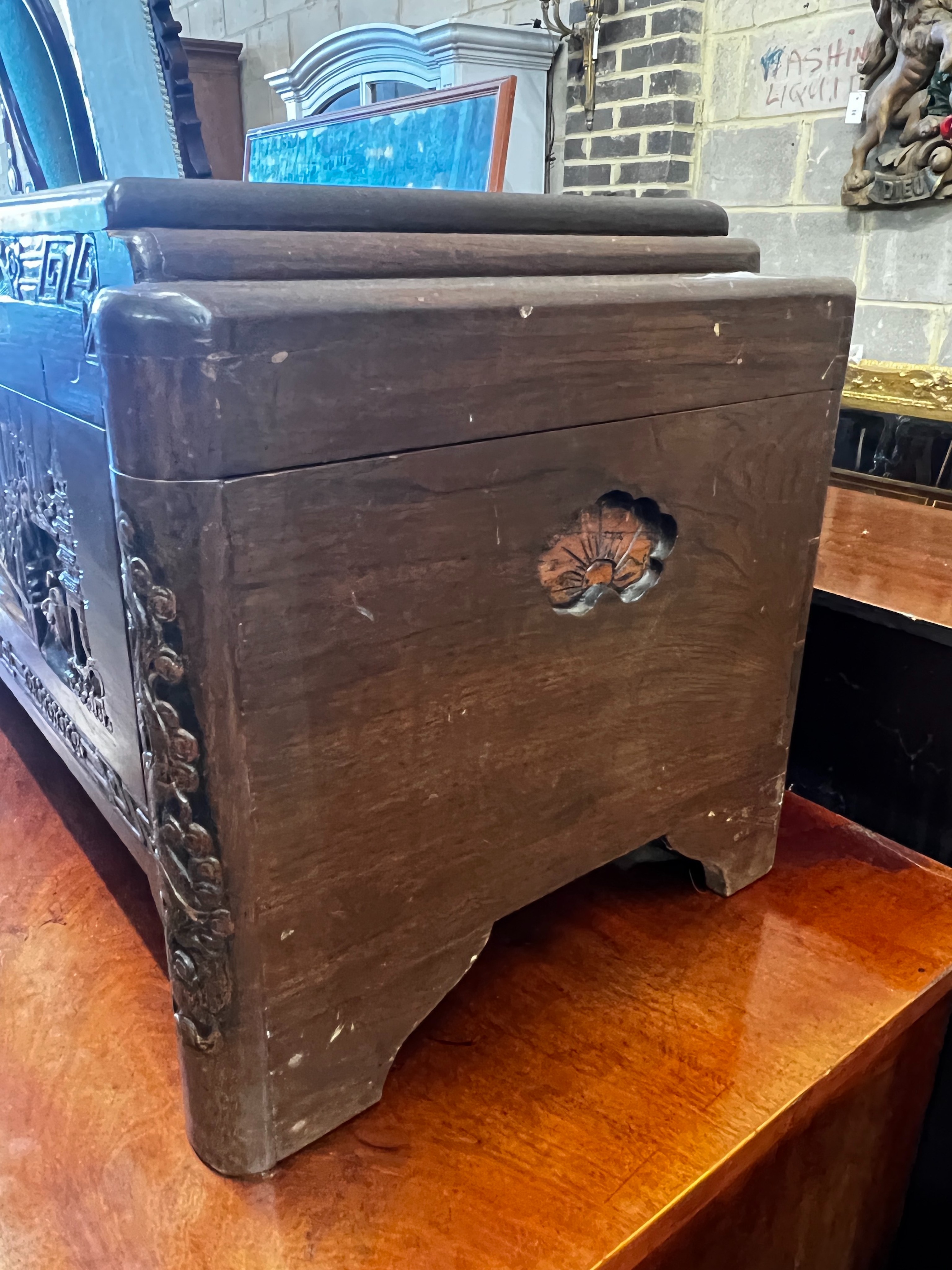 A small Chinese carved camphorwood trunk, length 80cm, depth 38cm, height 40cm